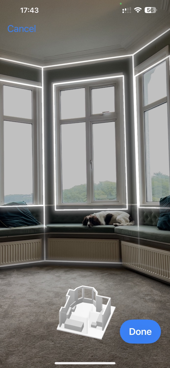 Heatworx scanning a bay-windowed room, the walls traced live on screen